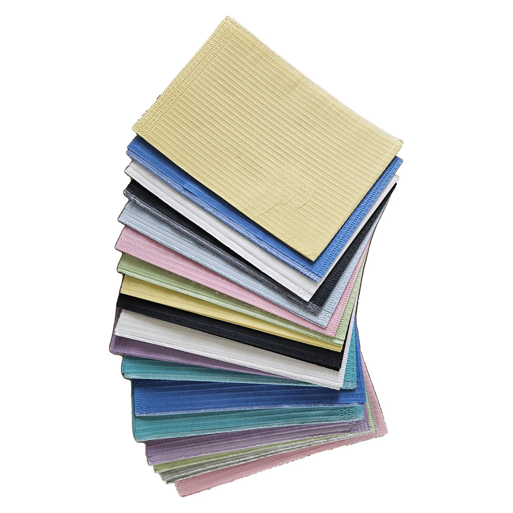 Aurelia dental bibs, assorted colours, fanned stack of multiple bibs on white background