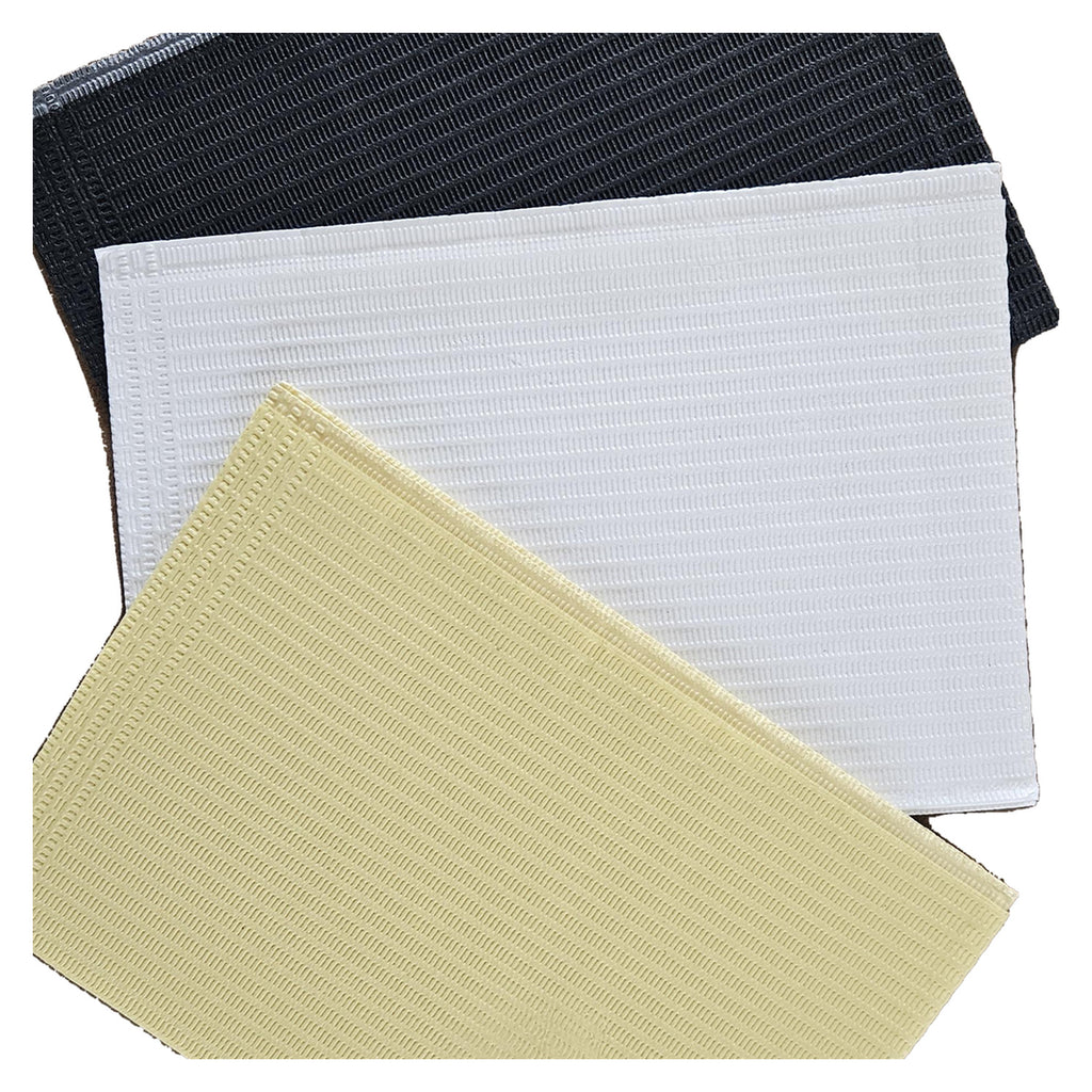 Aurelia dental bibs, pale yellow, white and dark grey, layered close-up of three stacked bibs