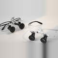 CliniEco flip-up dental loupes — dual-lens view, adjustable frame and declination